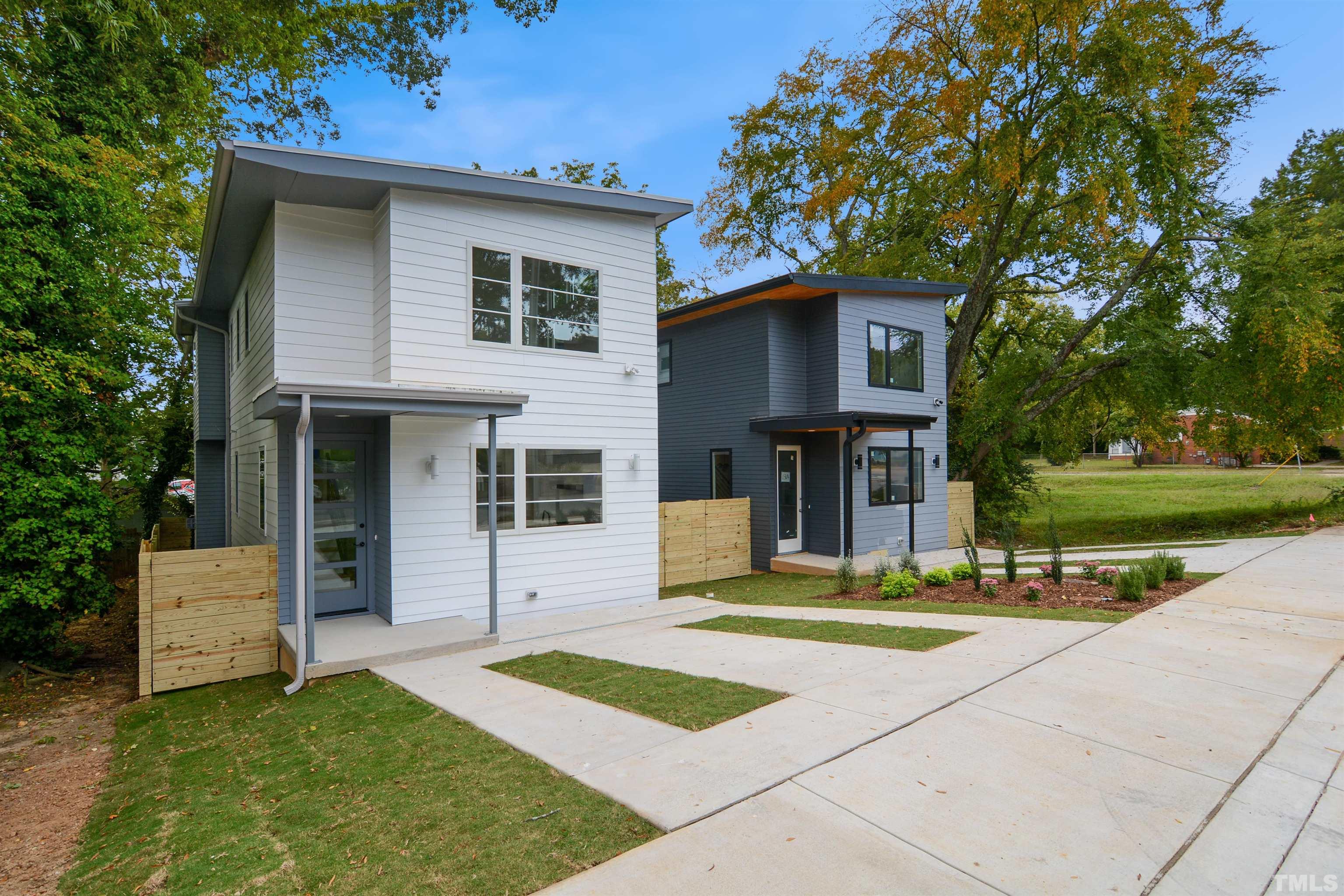 1306 East Lenoir Street Raleigh, NC 27610 - Photo 2 of 26 a front view of a house with a yard