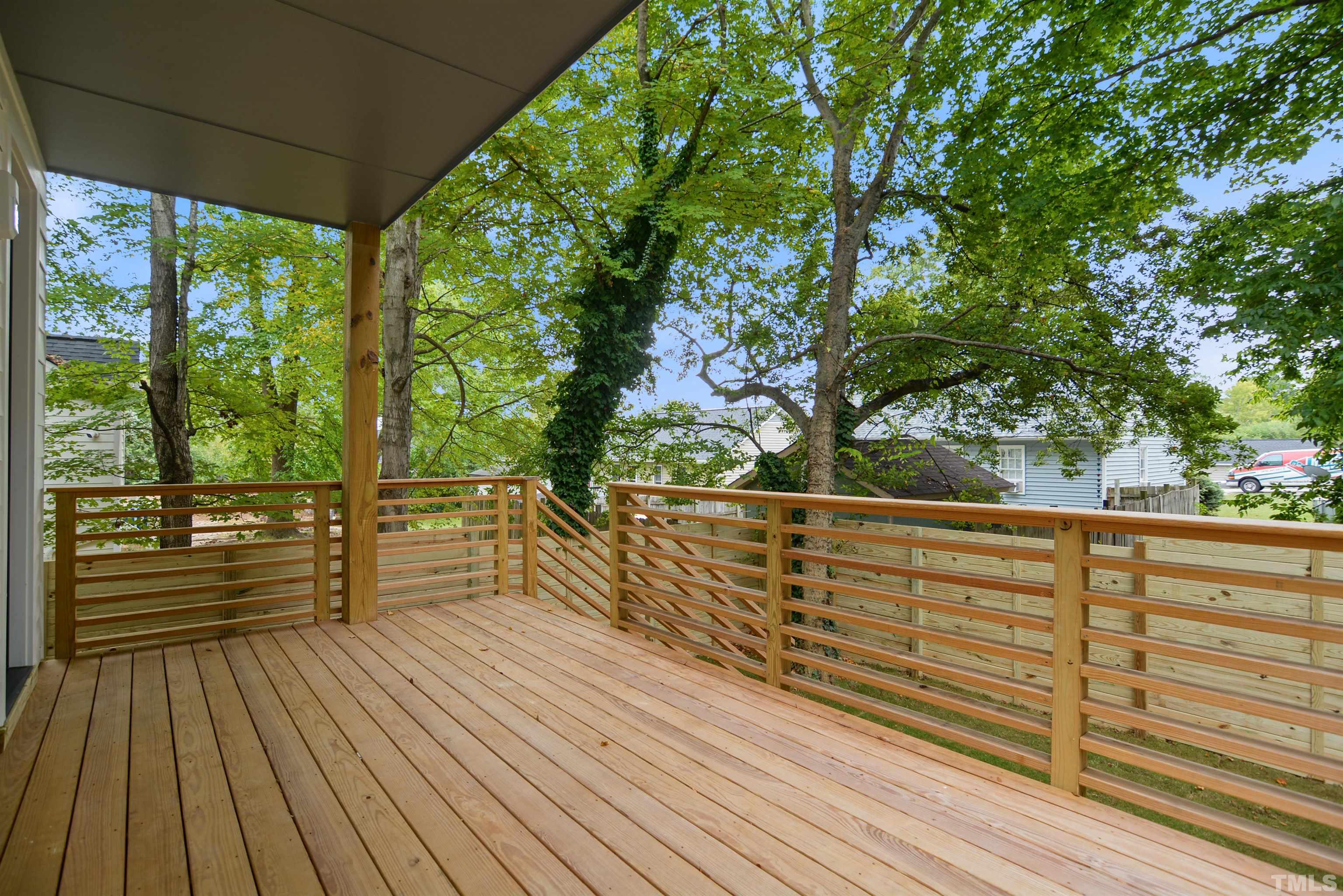 1306 East Lenoir Street Raleigh, NC 27610 - Photo 25 of 26 a view of a balcony with wooden floor
