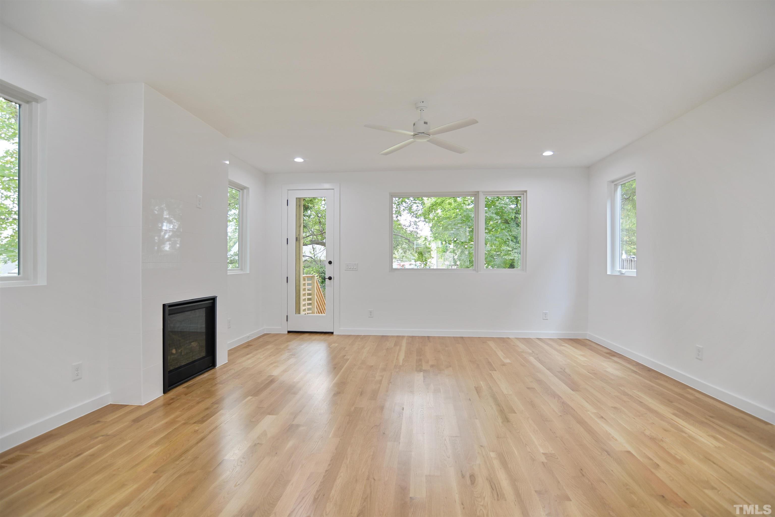 1306 East Lenoir Street Raleigh, NC 27610 - Photo 5 of 26 wooden floor in an empty room with a window
