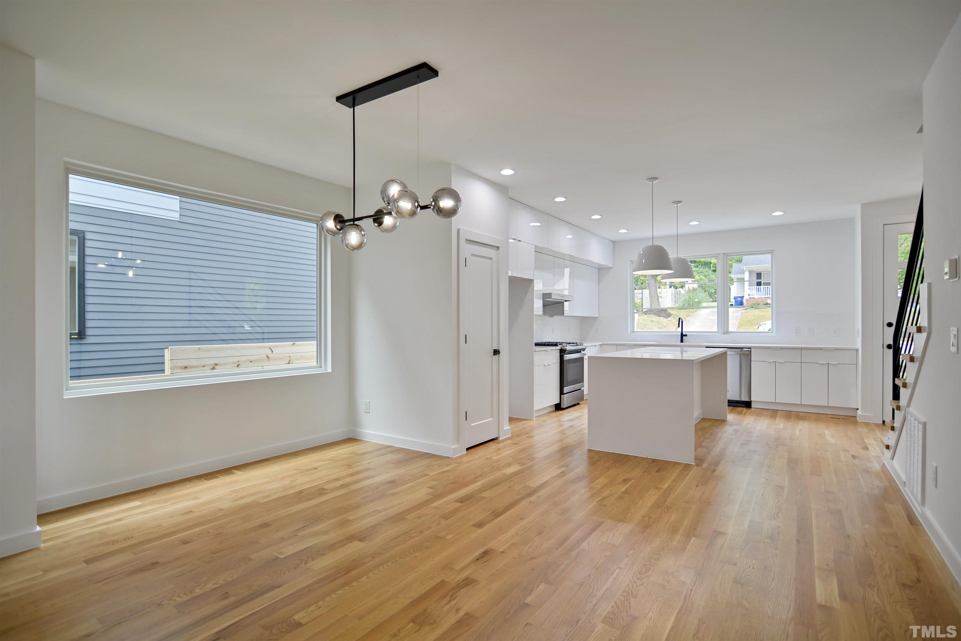 1306 East Lenoir Street Raleigh, NC 27610 - Photo 6 of 26 a view of a kitchen with wooden floor and a kitchen