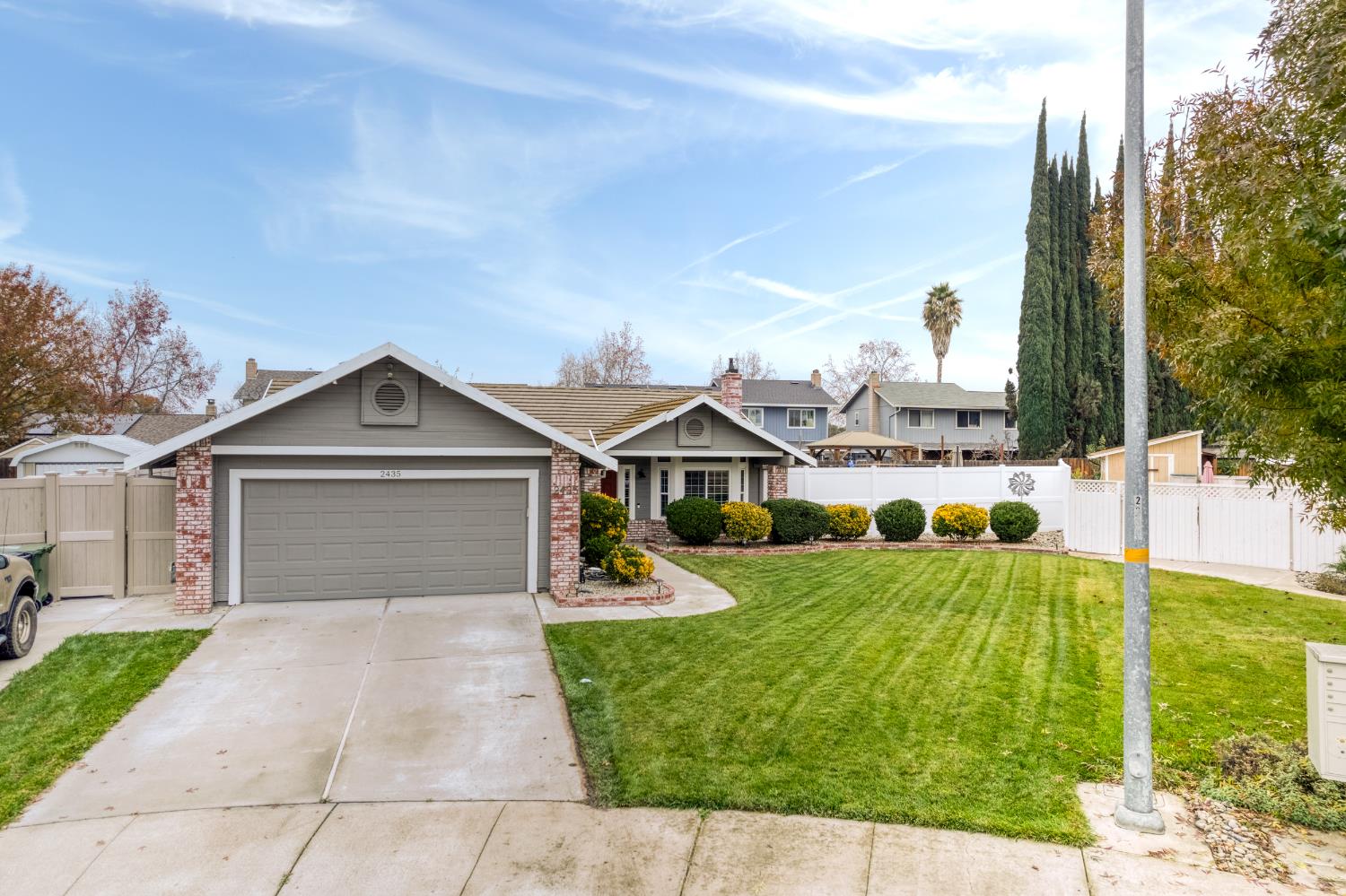 2435 Reyes Court Tracy, CA 95376 - Photo 1 of 1 front view of a house with a yard