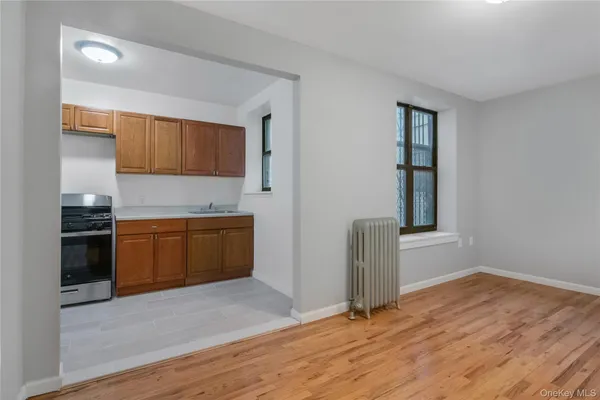 a kitchen with a refrigerator and a sink