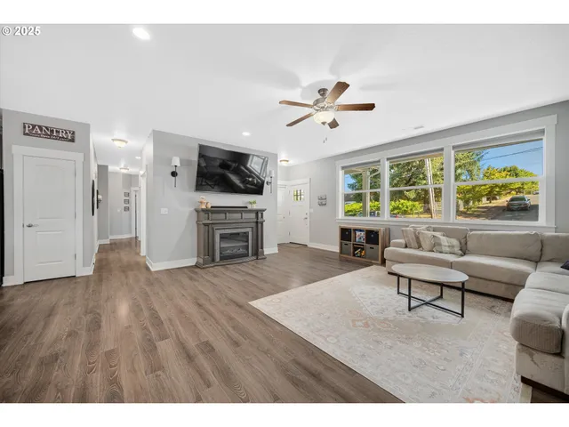 a living room with furniture fireplace and a flat screen tv