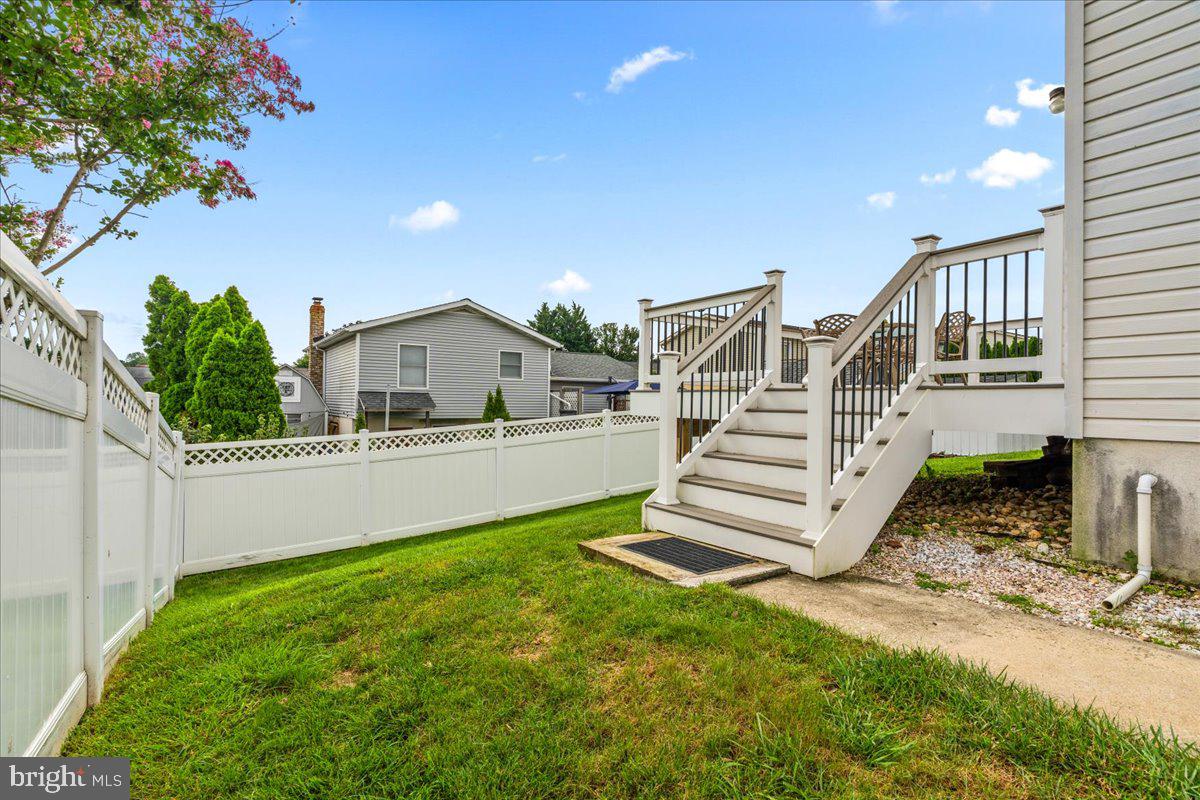 105 West Road Mount Airy, MD 21771 - Photo 30 of 39 Backyard walk way leads to the driveway