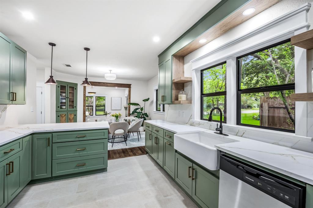 1014 Bolivar Street Denton, TX 76201 - Photo 13 of 36 a kitchen with lots of counter and windows