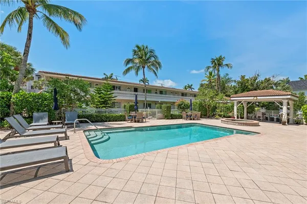 a view of a swimming pool with a patio