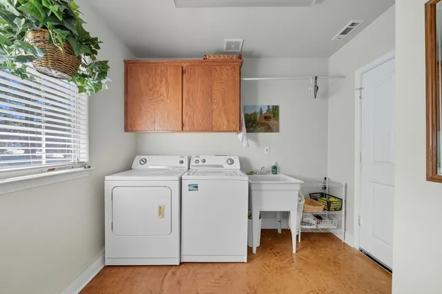 a view of backyard with a table and chairs