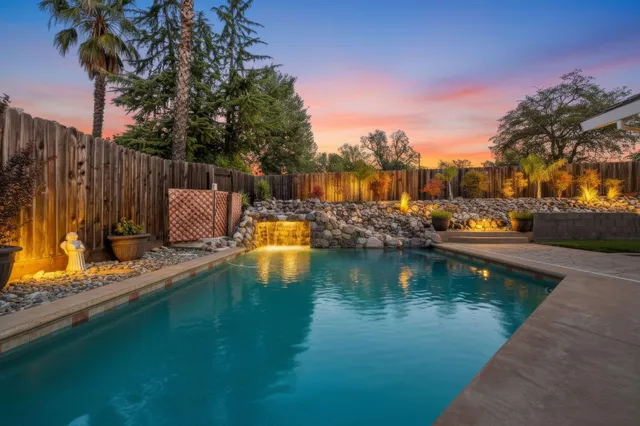 a view of yard with wooden fence