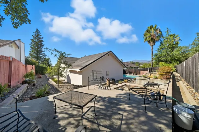 an aerial view of a house with swimming pool and outdoor space