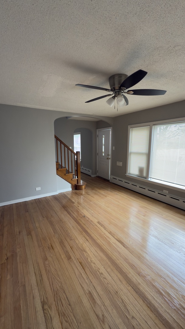 10800 South Green Street Chicago, IL 60643 - Photo 14 of 30 a view of an empty room with window and wooden floor