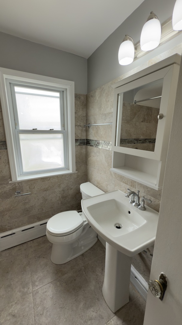 10800 South Green Street Chicago, IL 60643 - Photo 16 of 30 a bathroom with a sink mirror and toilet