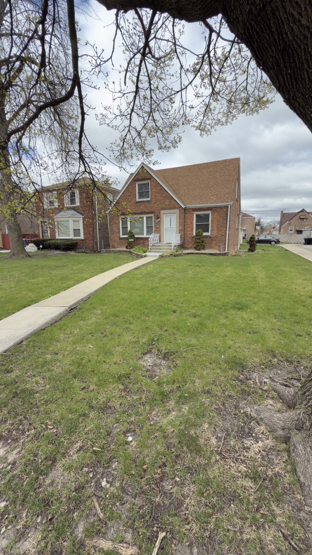 10800 South Green Street Chicago, IL 60643 - Photo 28 of 30 a front view of a house with a garden and trees