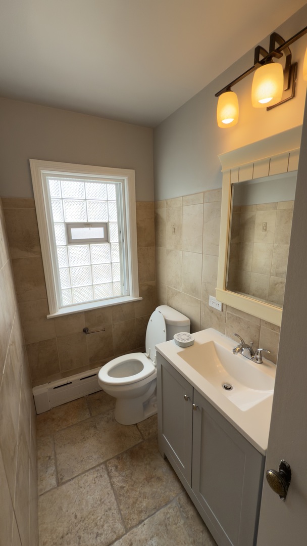 10800 South Green Street Chicago, IL 60643 - Photo 8 of 30 a bathroom with a toilet sink and mirror