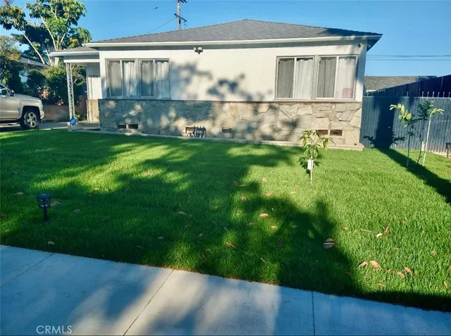 a view of backyard with a garden and plants