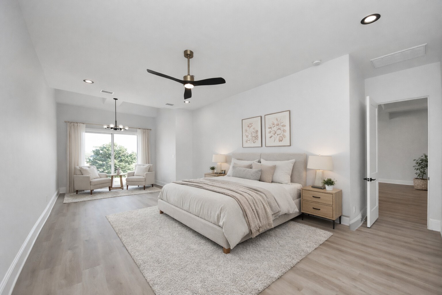 299 Peninsula Point Drive Montgomery, TX 77356 - Photo 22 of 50 The serene primary suite features a spacious sitting area and French doors that open to an extended patio overlooking the canal, creating a private retreat with seamless indoor-outdoor living.