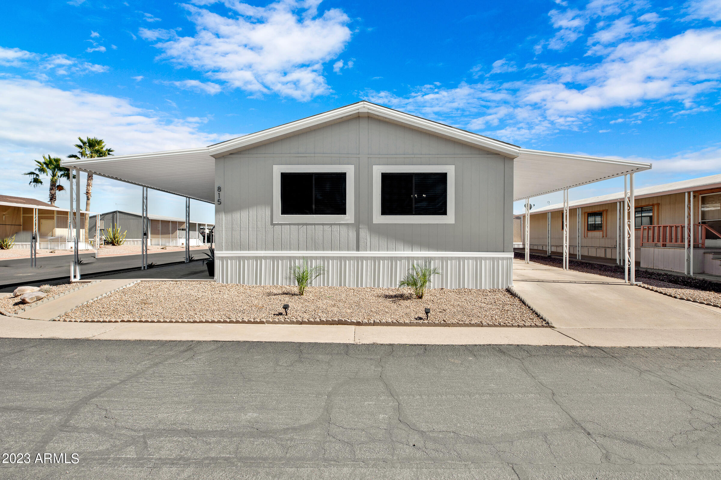 301 South Signal Butte Road, Unit 815 Apache Junction, AZ 85120 - Photo 13 of 15 a view of a house with a patio