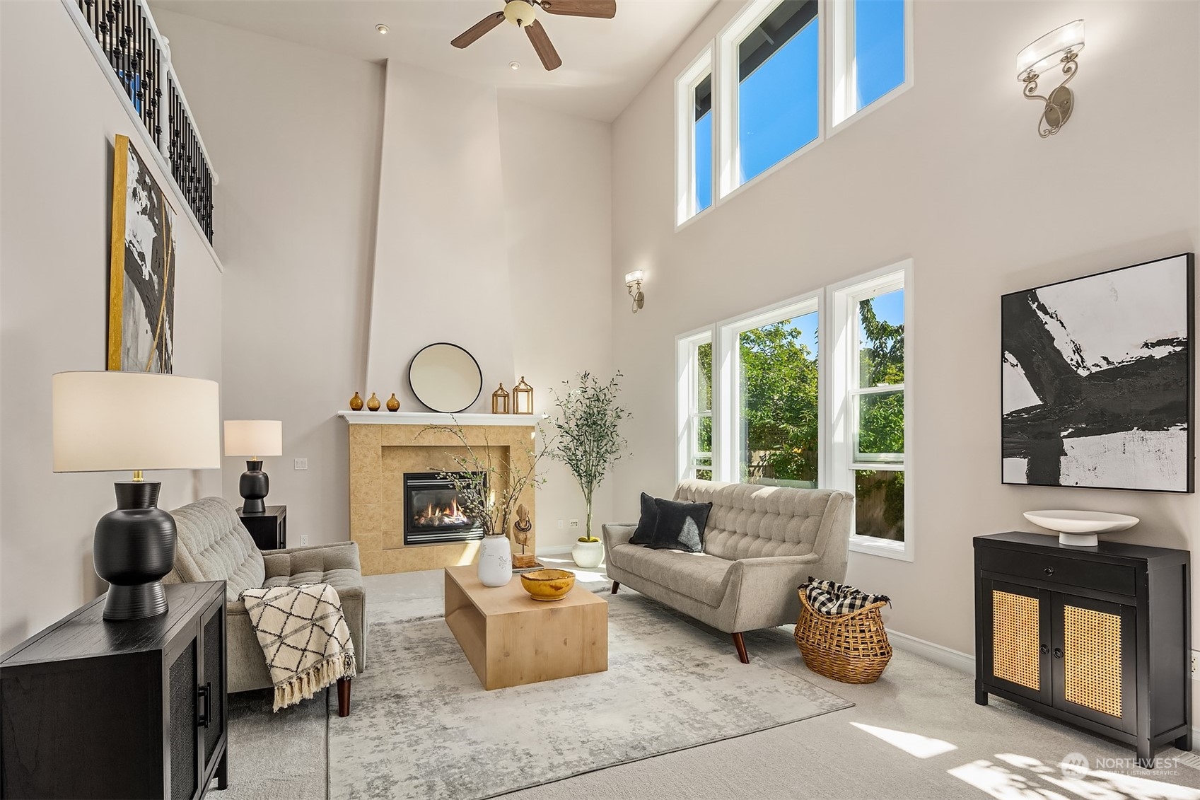 21104 39th Avenue Southeast Bothell, WA 98021 - Photo 17 of 36 a living room with furniture a fireplace and a large window