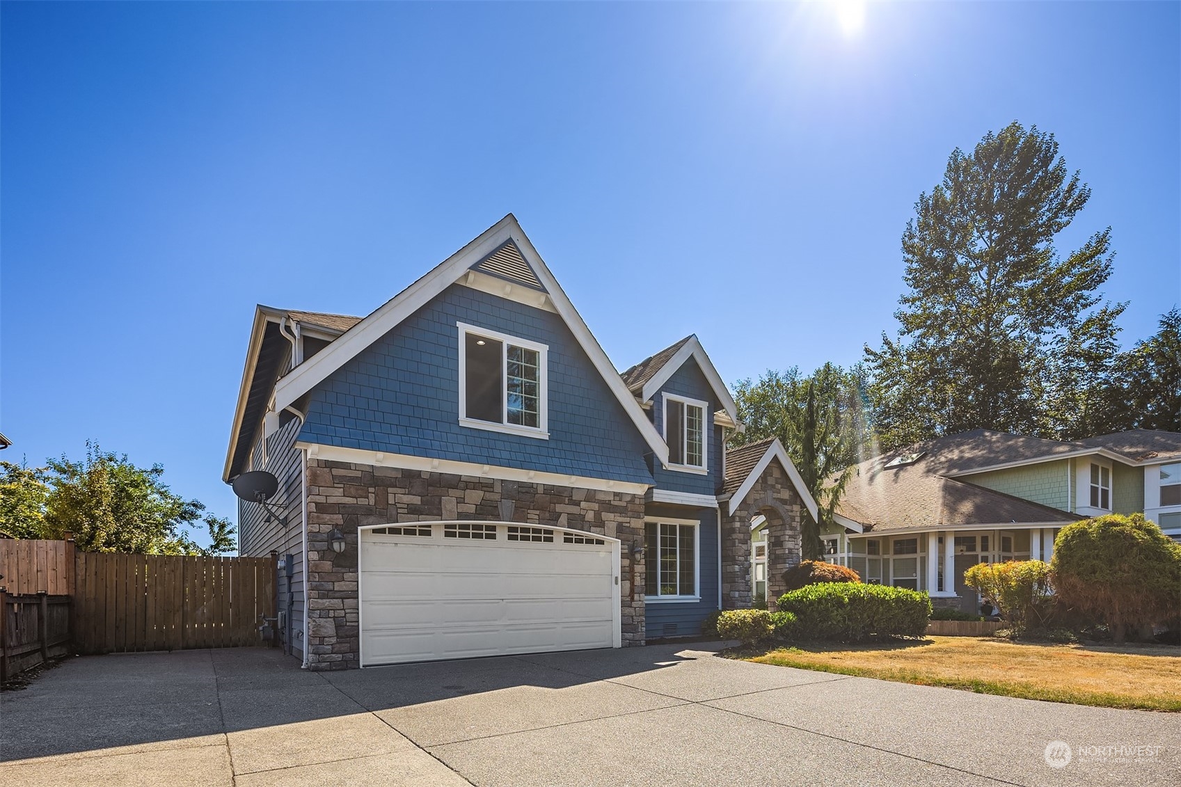 21104 39th Avenue Southeast Bothell, WA 98021 - Photo 2 of 36 a front view of a house with a garden