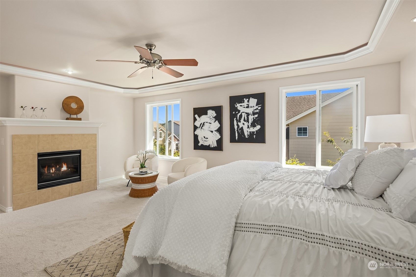 21104 39th Avenue Southeast Bothell, WA 98021 - Photo 22 of 36 a bedroom with a large bed a fireplace and window