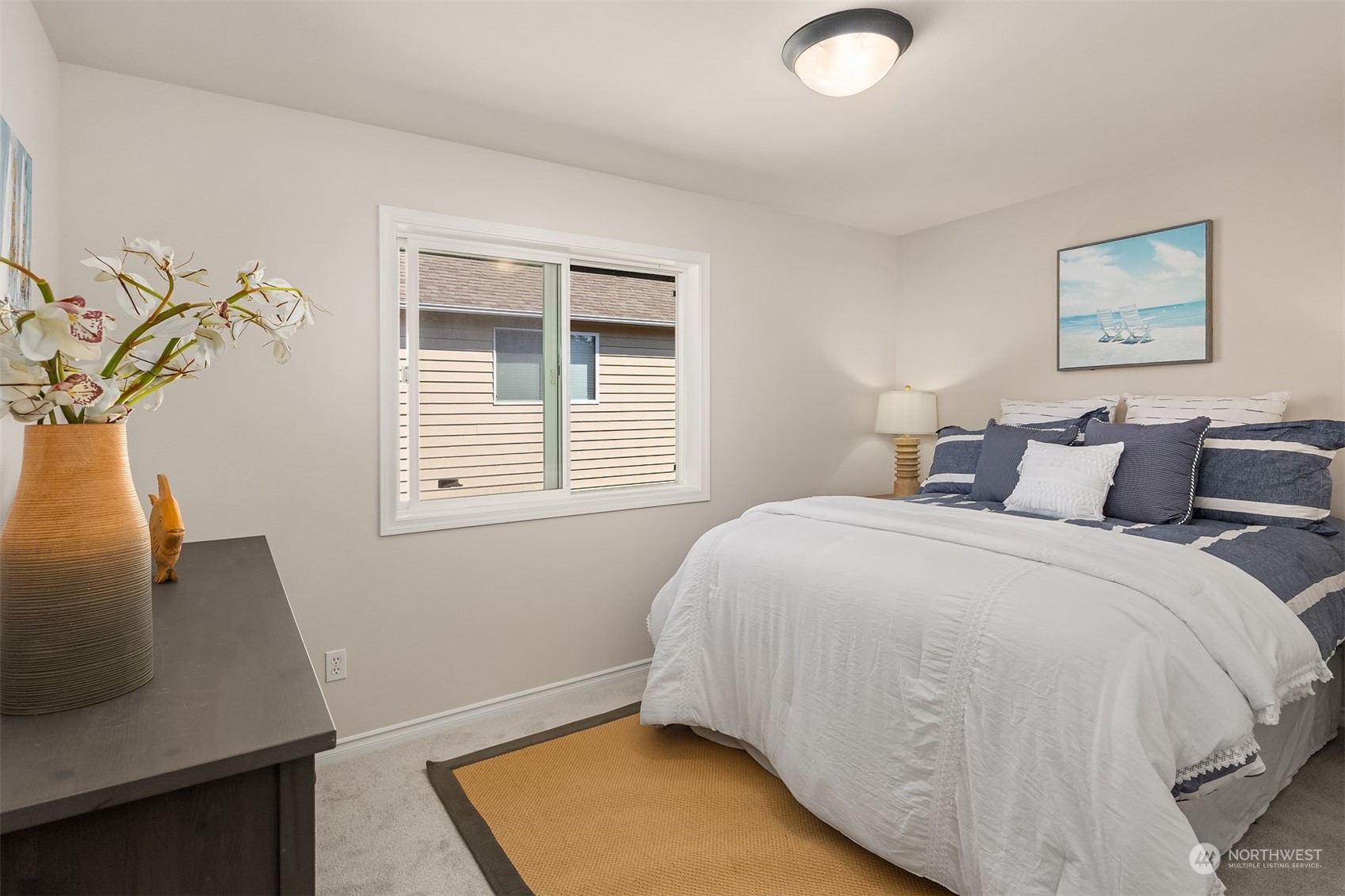 21104 39th Avenue Southeast Bothell, WA 98021 - Photo 26 of 36 a bedroom with a bed and a window