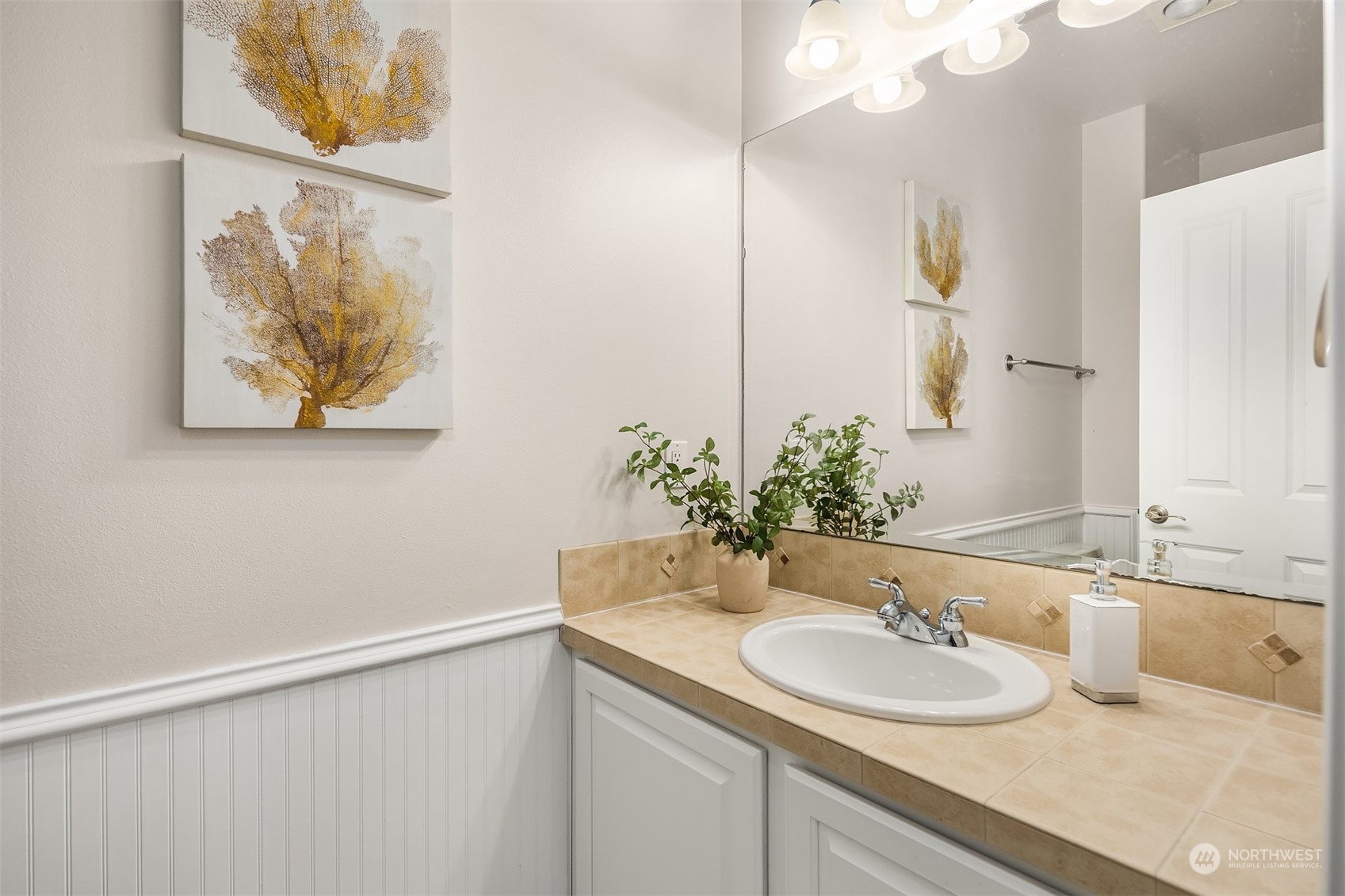 21104 39th Avenue Southeast Bothell, WA 98021 - Photo 30 of 36 a bathroom with a sink and a mirror