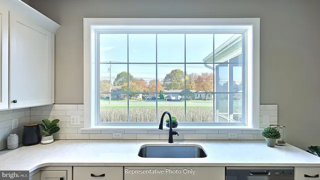 a kitchen with a sink and a window