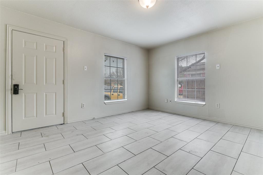 7909 Wanebe Drive Dallas, TX 75235 - Photo 4 of 25 Spare room featuring baseboards