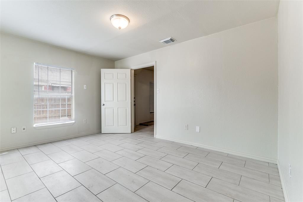 7909 Wanebe Drive Dallas, TX 75235 - Photo 5 of 25 Spare room with baseboards