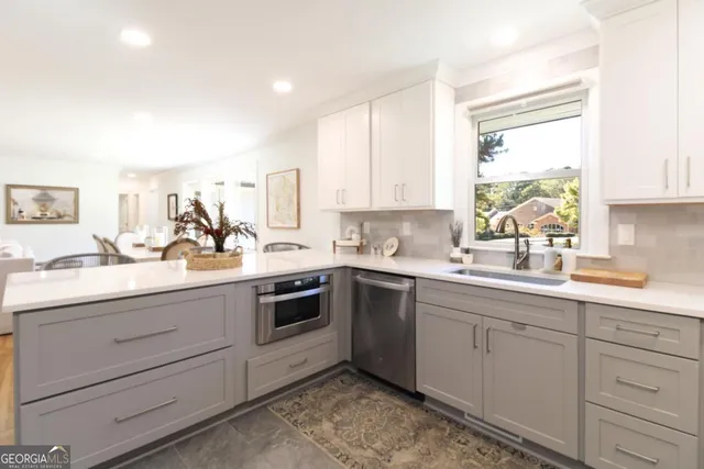 a kitchen with sink cabinets and window