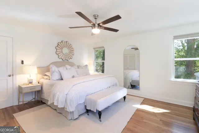 a bedroom with a bed and window