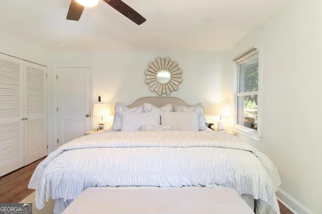 a bedroom with a bed and window