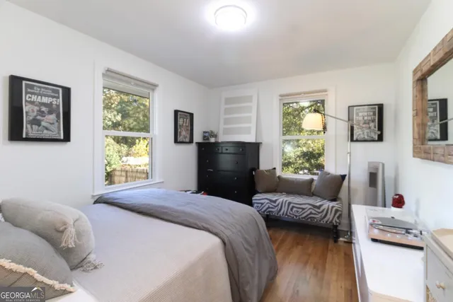 a bedroom with a bed and a couch