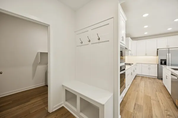 a kitchen with stainless steel appliances a refrigerator and a stove top oven