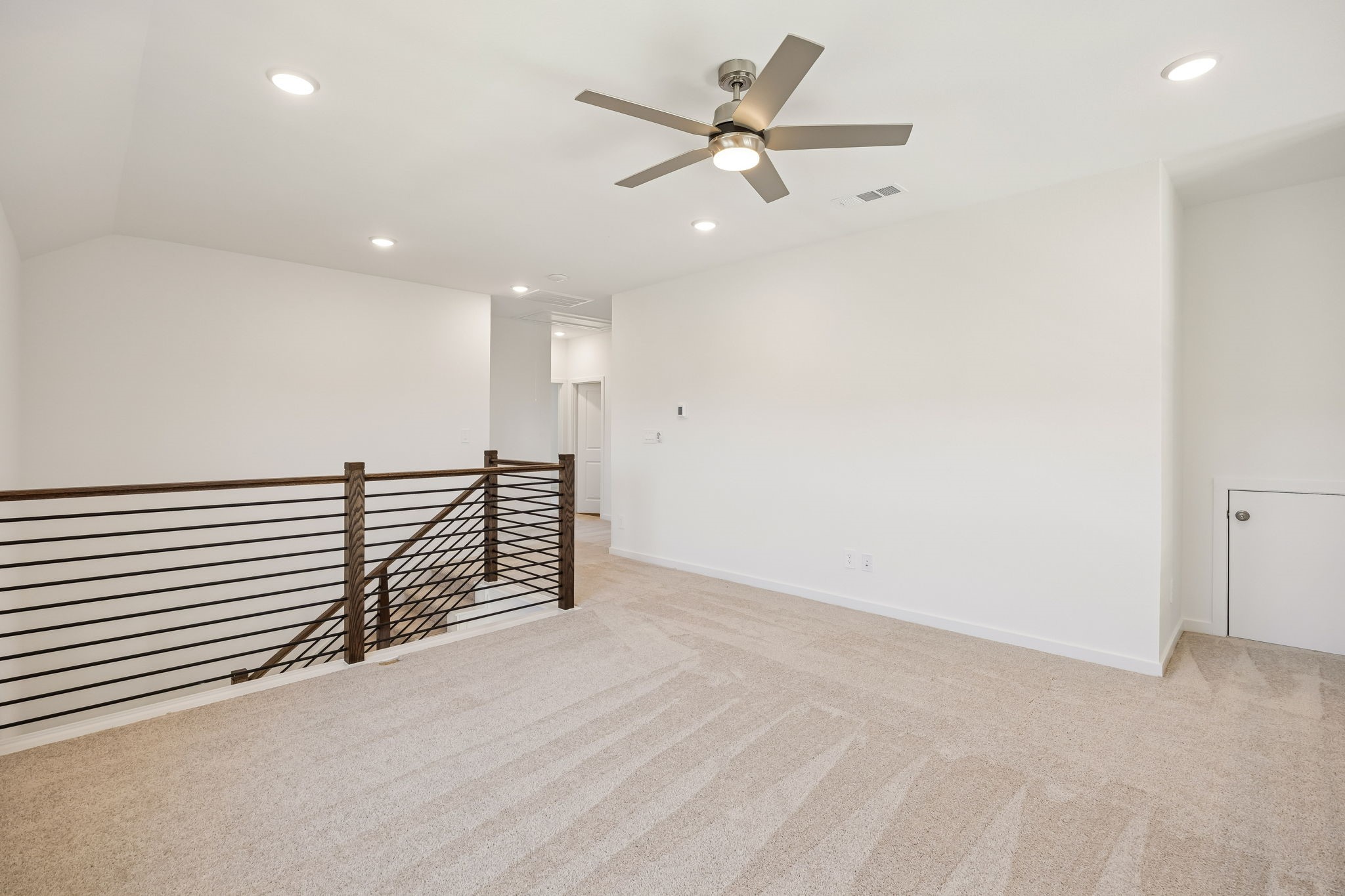 214 Pr Rdg Lane Montgomery, TX 77356 - Photo 19 of 35 an empty room with wooden floor fan and windows