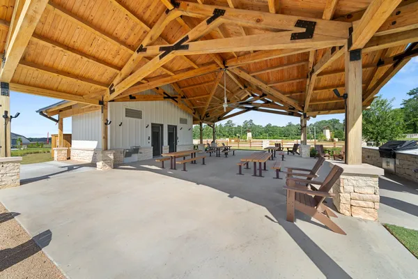 a view of a patio with a table and chairs