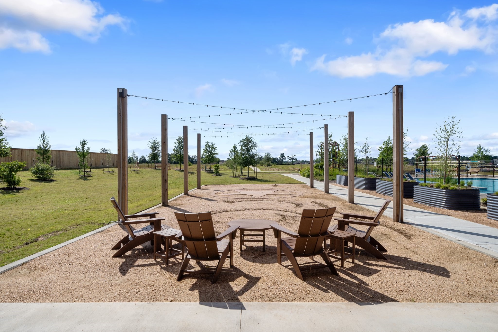 214 Pr Rdg Lane Montgomery, TX 77356 - Photo 34 of 35 a view of a patio with table and chairs and garden view