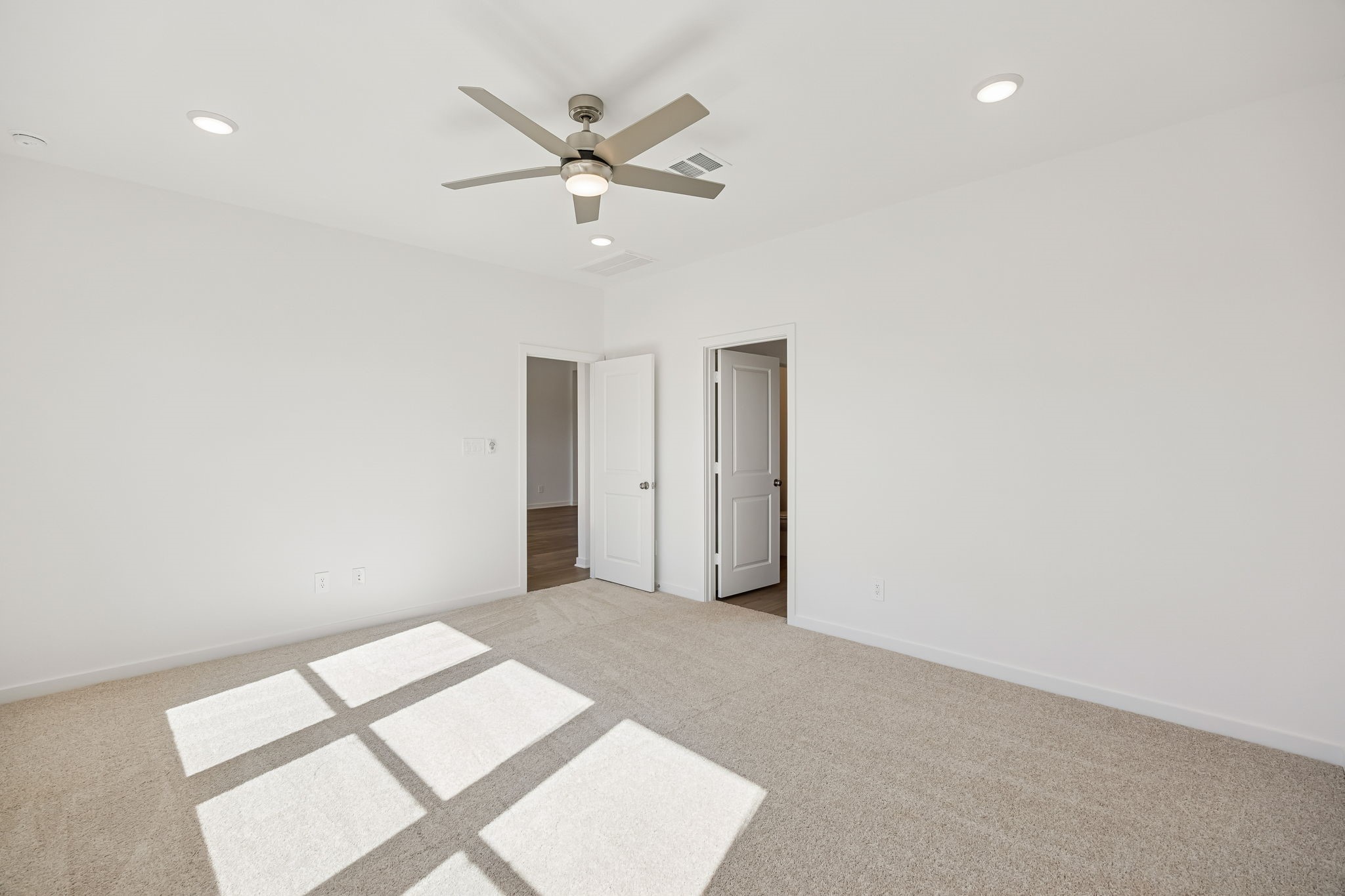 214 Pr Rdg Lane Montgomery, TX 77356 - Photo 10 of 35 an empty room with a window and a fan