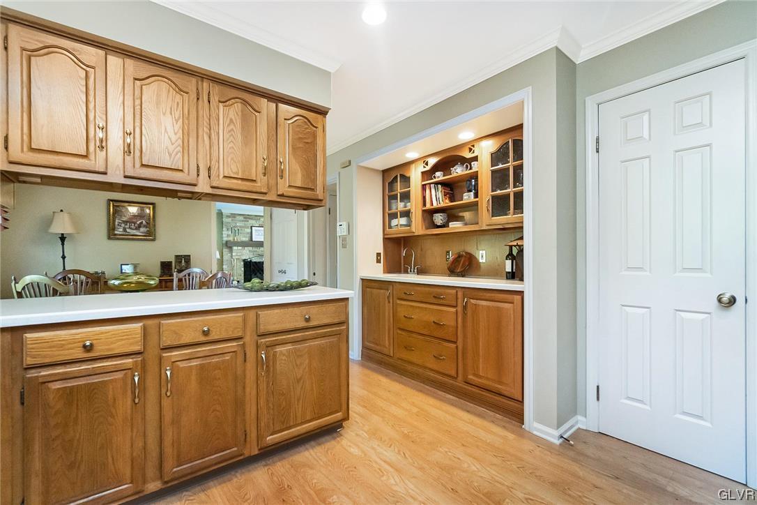 2285 Woodbarn Road Lower Macungie Township, PA 18062 - Photo 11 of 45 a kitchen with stainless steel appliances granite countertop a refrigerator and cabinets
