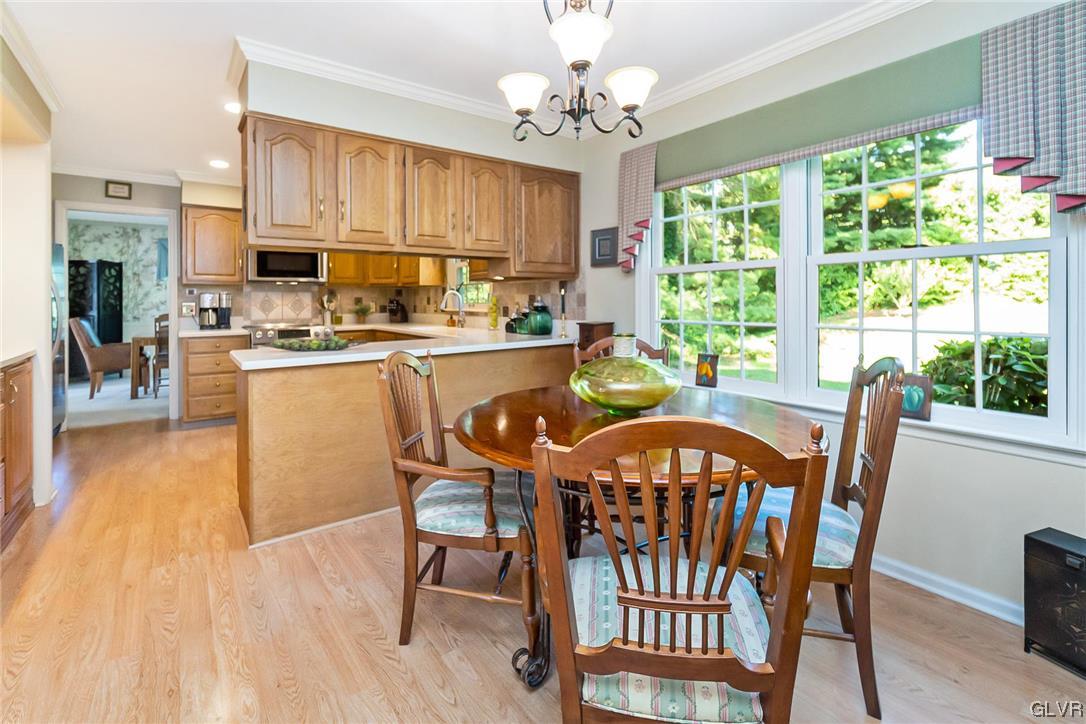 2285 Woodbarn Road Lower Macungie Township, PA 18062 - Photo 15 of 45 a view of a dining room with furniture window and wooden floor