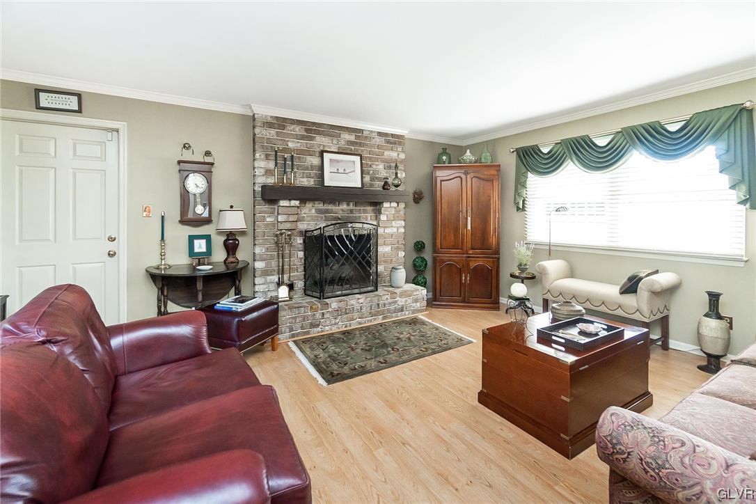 2285 Woodbarn Road Lower Macungie Township, PA 18062 - Photo 18 of 45 a living room with furniture and a fireplace