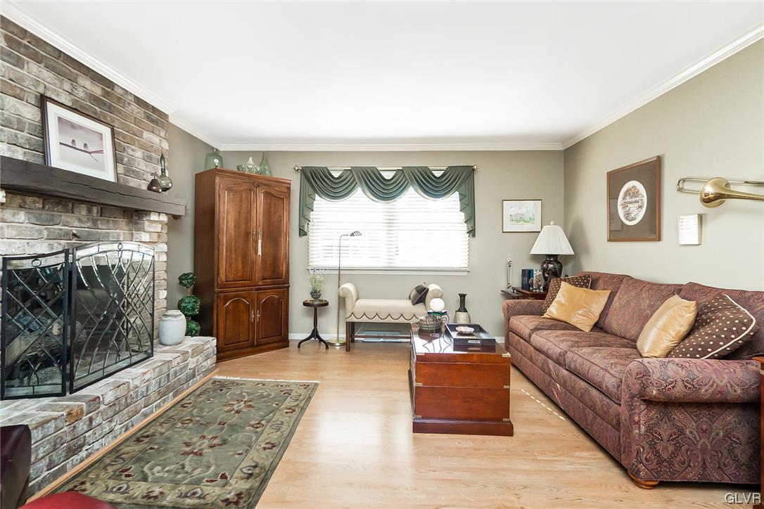 2285 Woodbarn Road Lower Macungie Township, PA 18062 - Photo 19 of 45 a living room with furniture and a rug