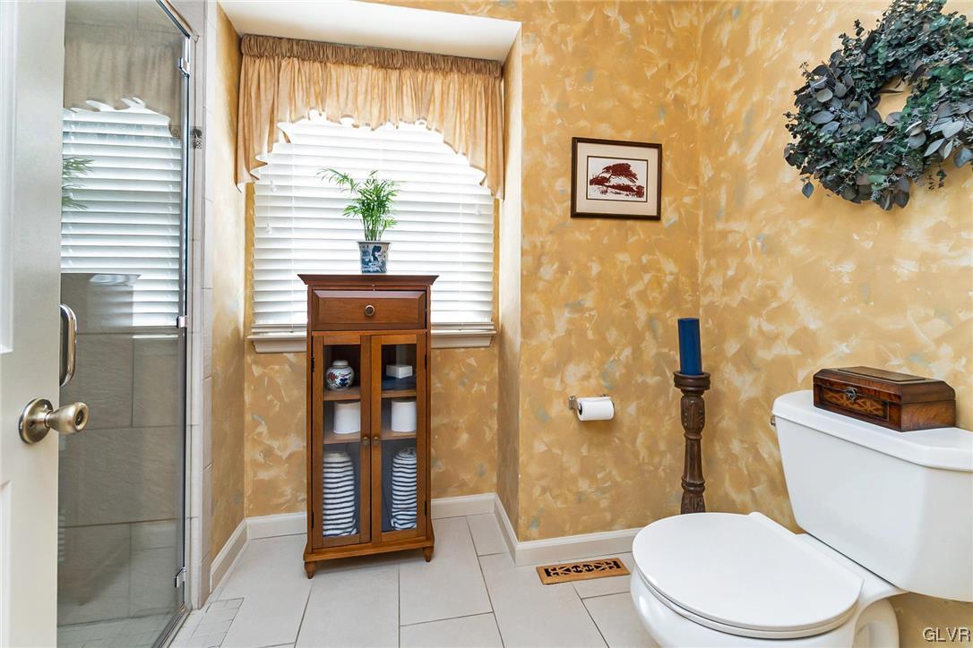 2285 Woodbarn Road Lower Macungie Township, PA 18062 - Photo 25 of 45 a bathroom with a toilet sink and shower