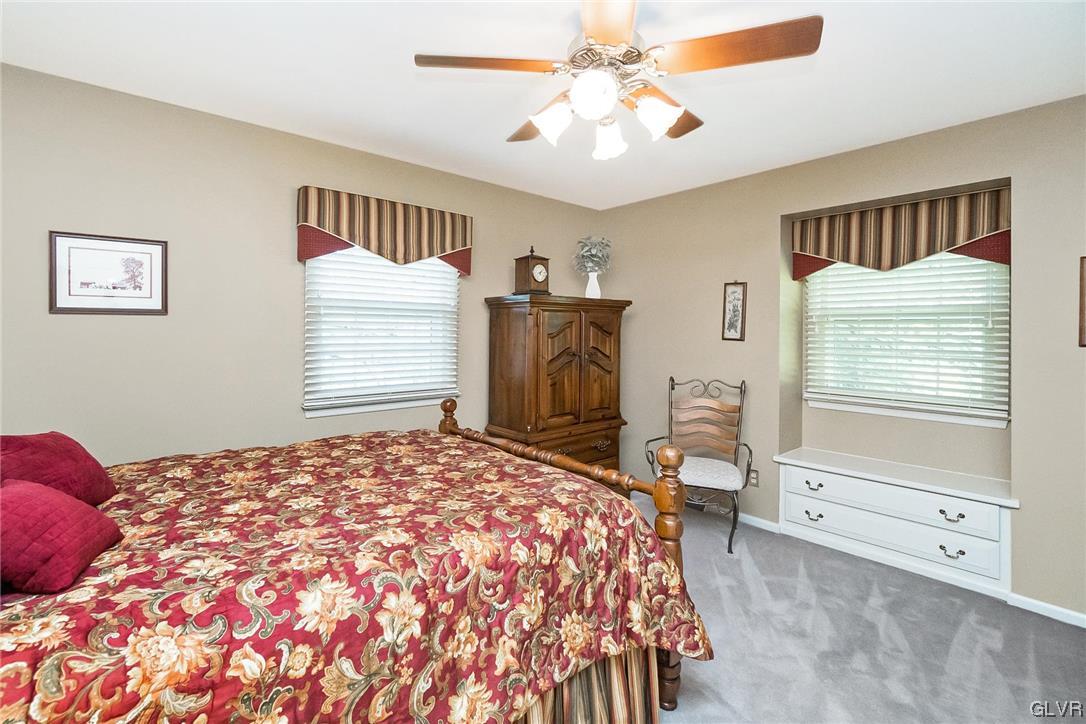 2285 Woodbarn Road Lower Macungie Township, PA 18062 - Photo 29 of 45 a bedroom with a bed and a chandelier