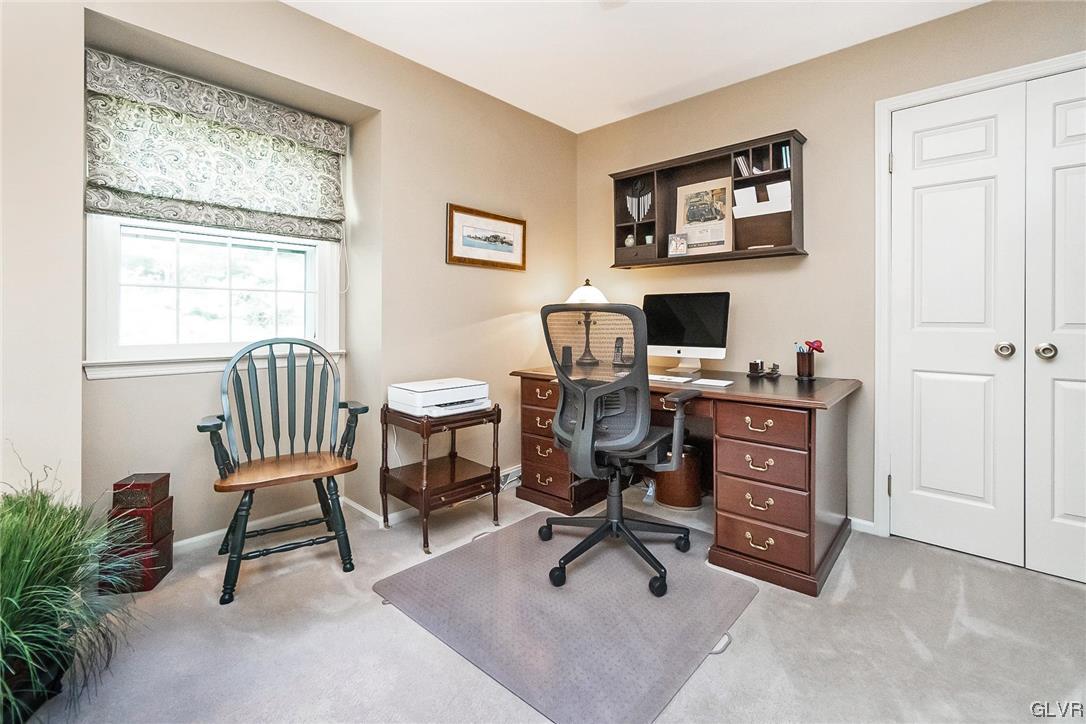 2285 Woodbarn Road Lower Macungie Township, PA 18062 - Photo 31 of 45 a view of a workspace with furniture and a window