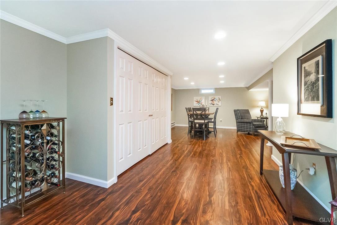 2285 Woodbarn Road Lower Macungie Township, PA 18062 - Photo 35 of 45 a view of a living room hardwood floor and a kitchen with wooden floor