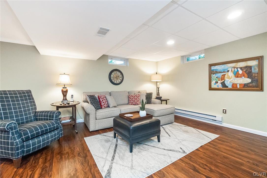 2285 Woodbarn Road Lower Macungie Township, PA 18062 - Photo 36 of 45 a living room with furniture and a wooden floor