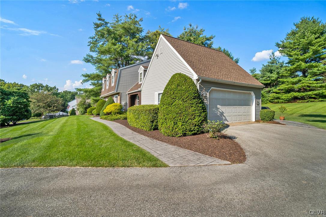 2285 Woodbarn Road Lower Macungie Township, PA 18062 - Photo 40 of 45 a front view of a house with a yard and garage