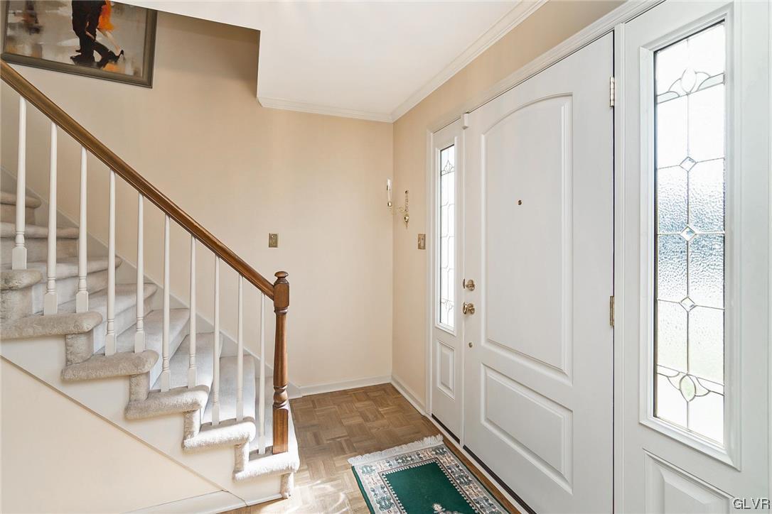 2285 Woodbarn Road Lower Macungie Township, PA 18062 - Photo 4 of 45 a view of a hallway with wooden floor and entryway