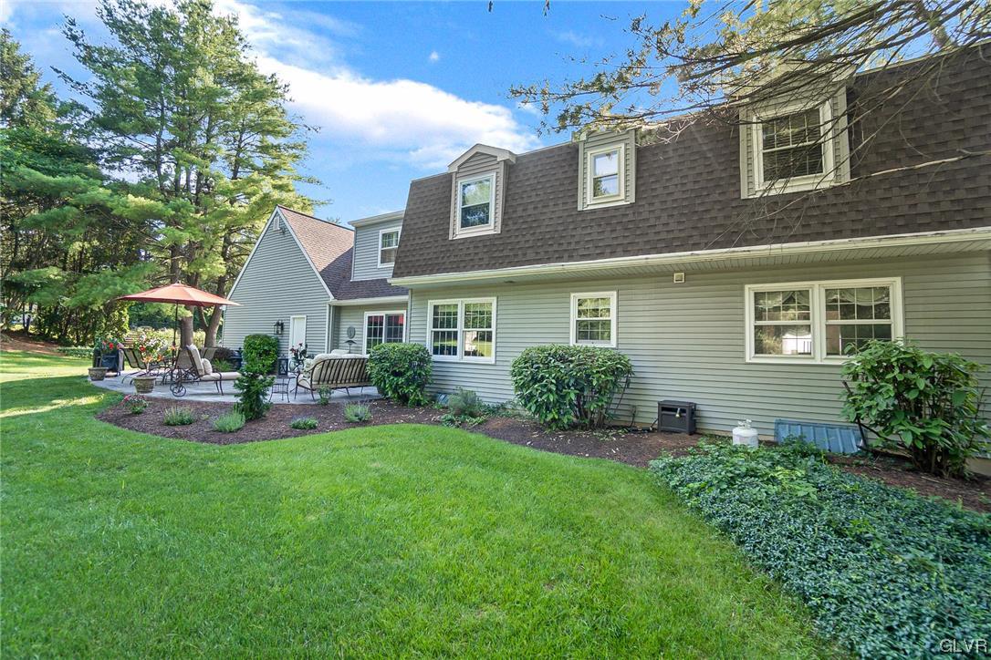 2285 Woodbarn Road Lower Macungie Township, PA 18062 - Photo 41 of 45 a front view of a house with swimming pool having outdoor seating