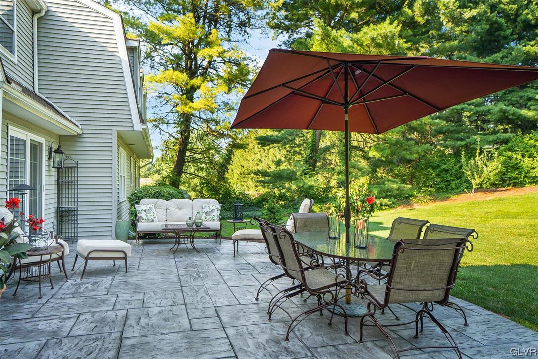 2285 Woodbarn Road Lower Macungie Township, PA 18062 - Photo 43 of 45 a patio with a patio table and chairs